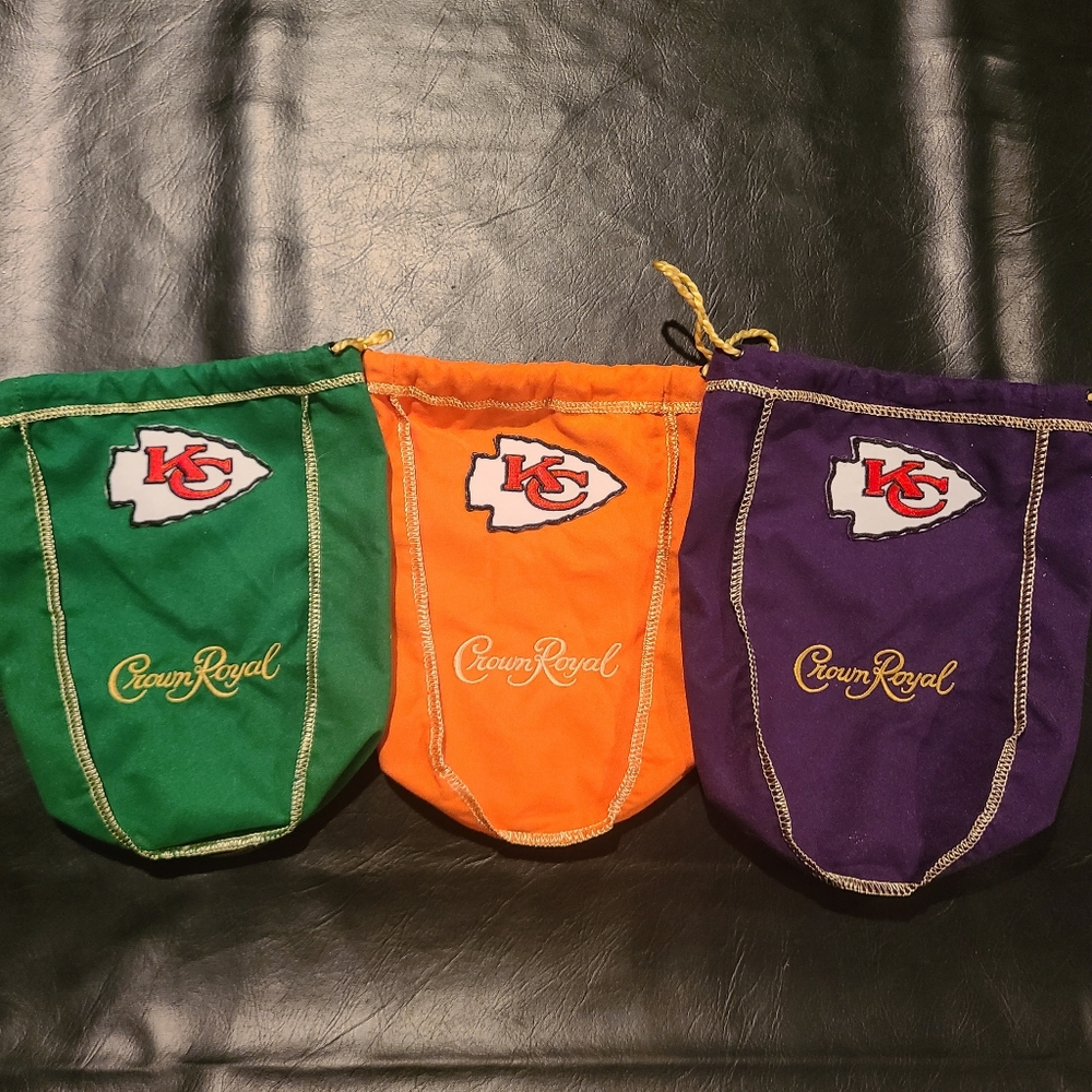 Three Crown Royal bags with sewn on Chiefs logo.